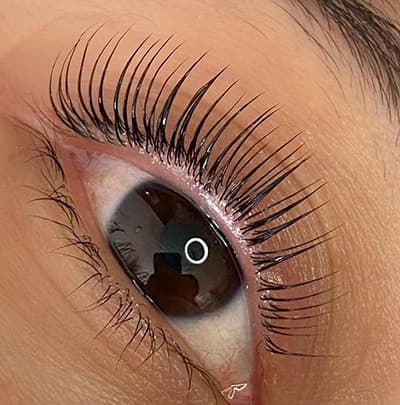 Happy client showing off her stunning lifted and tinted lashes by Diamond Eyelash Extensions in Melbourne.